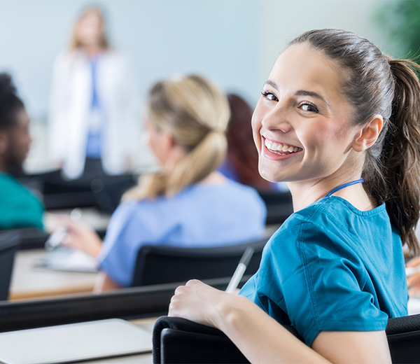 Smiling medical student sitting in chair